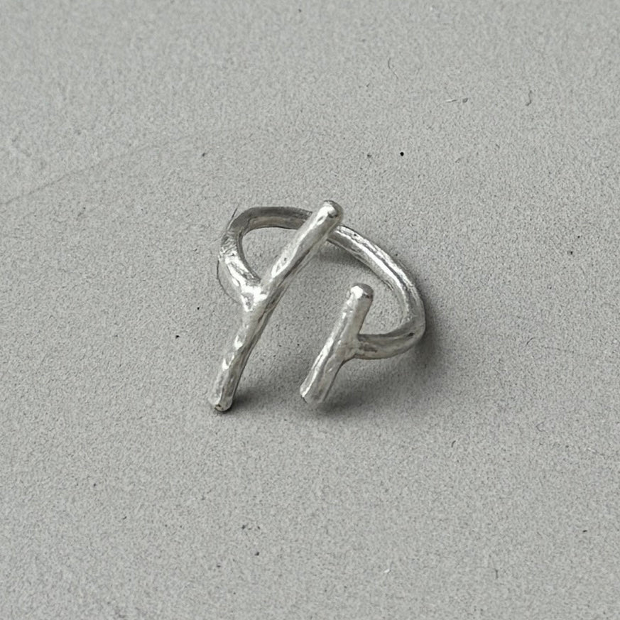 photo of a silver ring with a minimalist 2 lines design