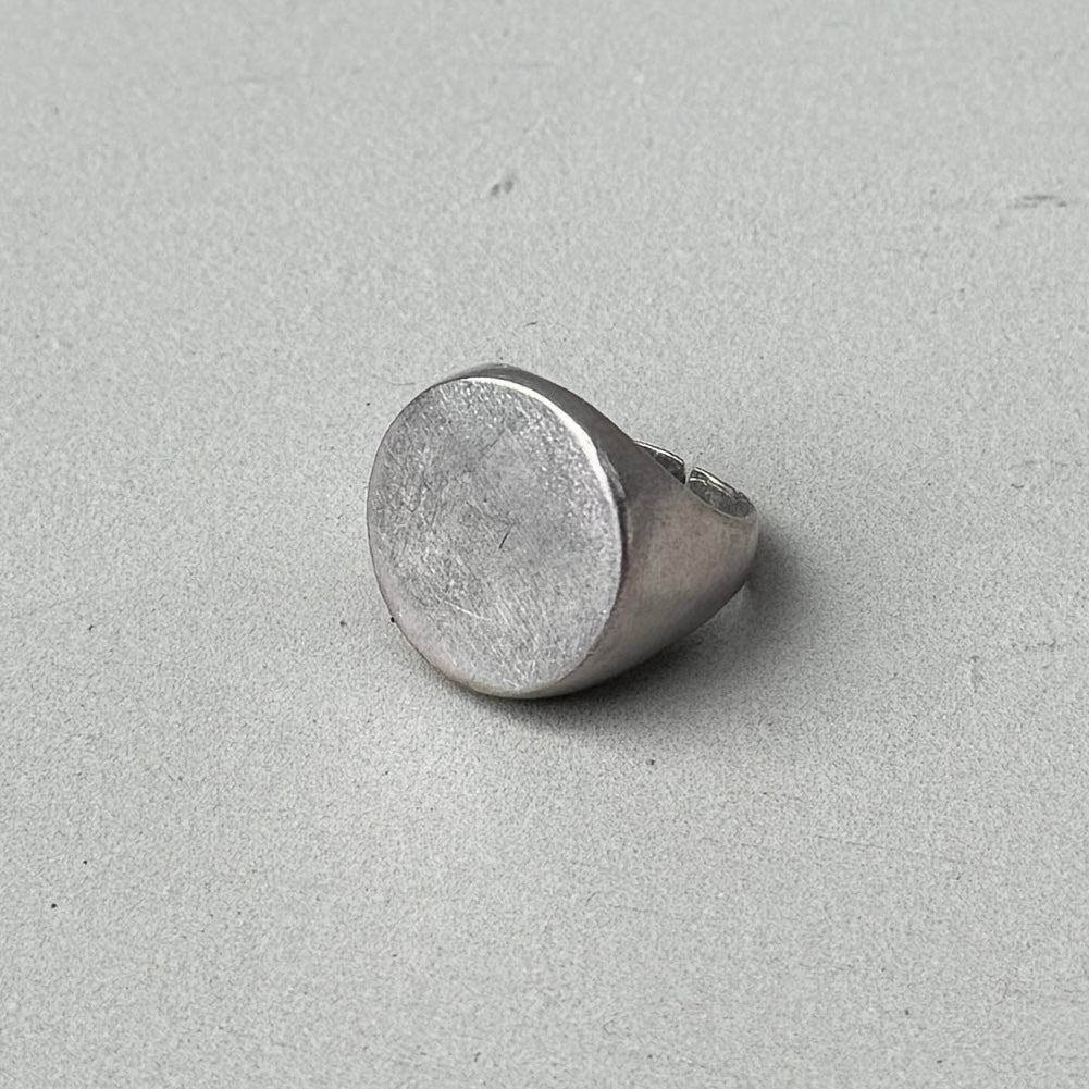 photo of a circle silver signet ring