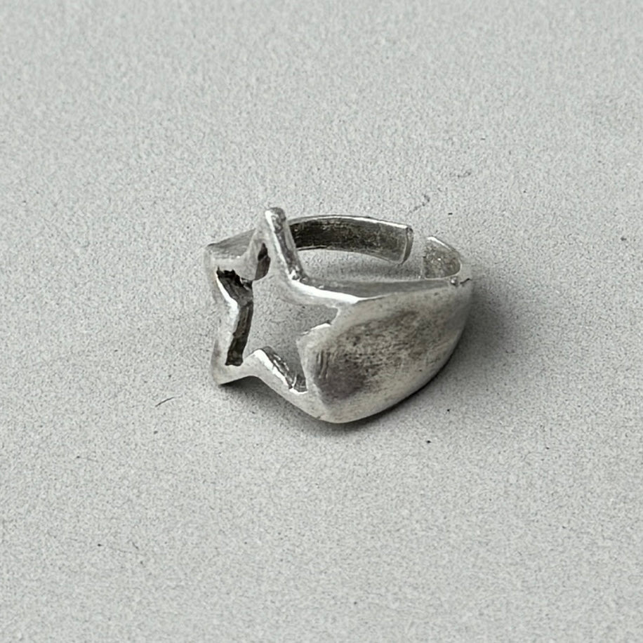 photo of a silver ring with a shooting star design and vintage silver finish.