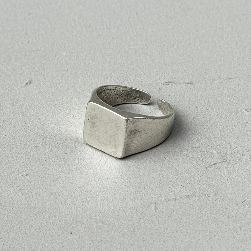 photo of a square silver signet ring